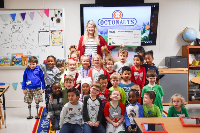 Teacher and students pose with grant check