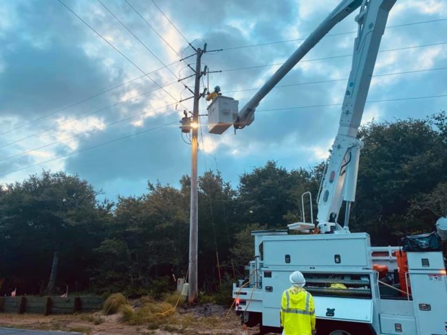 LIneworker in a bucket truck restoring power