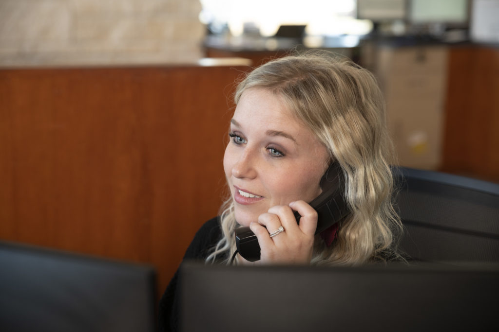 Cooperative Employee on Phone